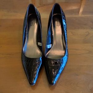 Brown moc croc shoes with a three inch wooden heel. Barely worn.